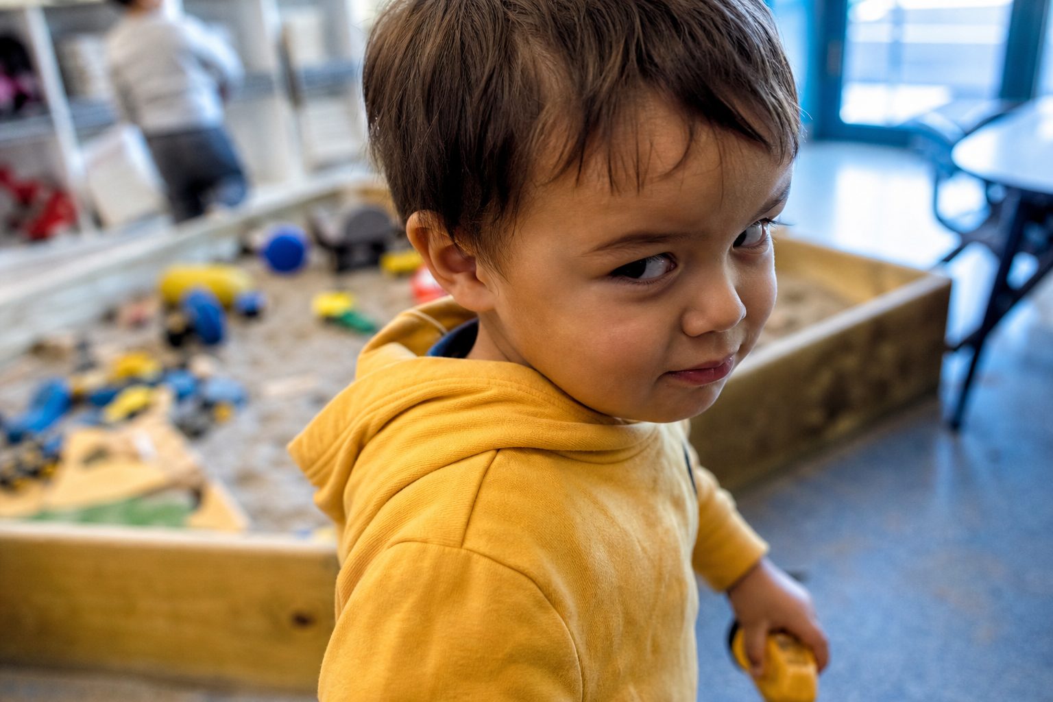 Child looking suspiciously sideways at the camera