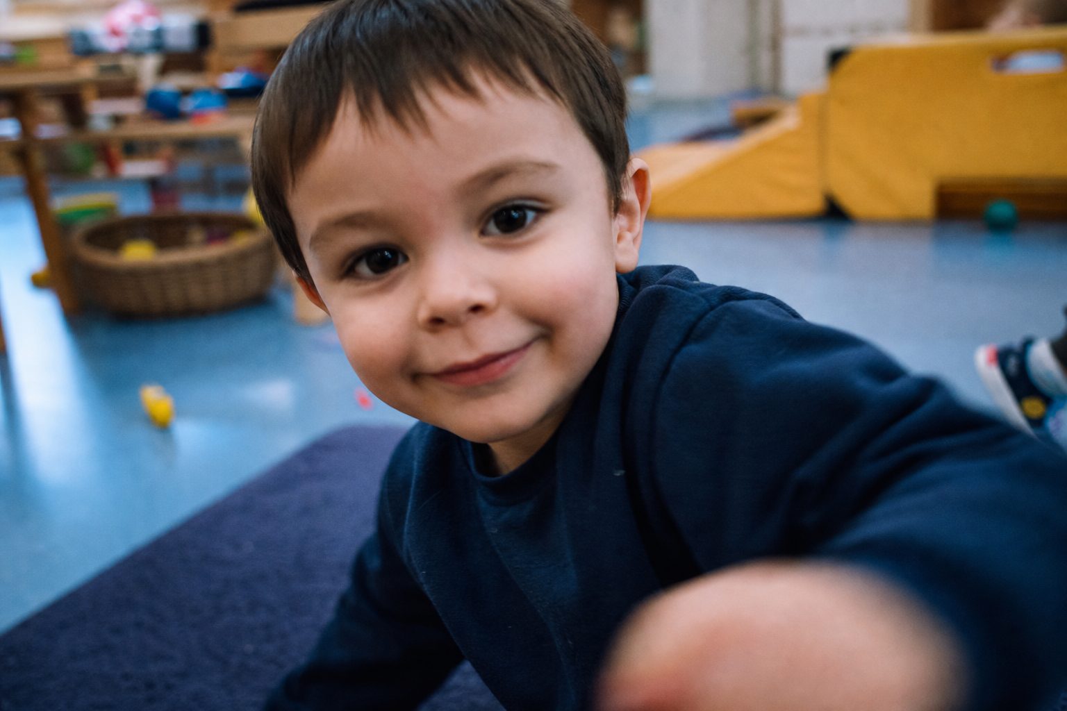 Quiet child with a small genuine half smile