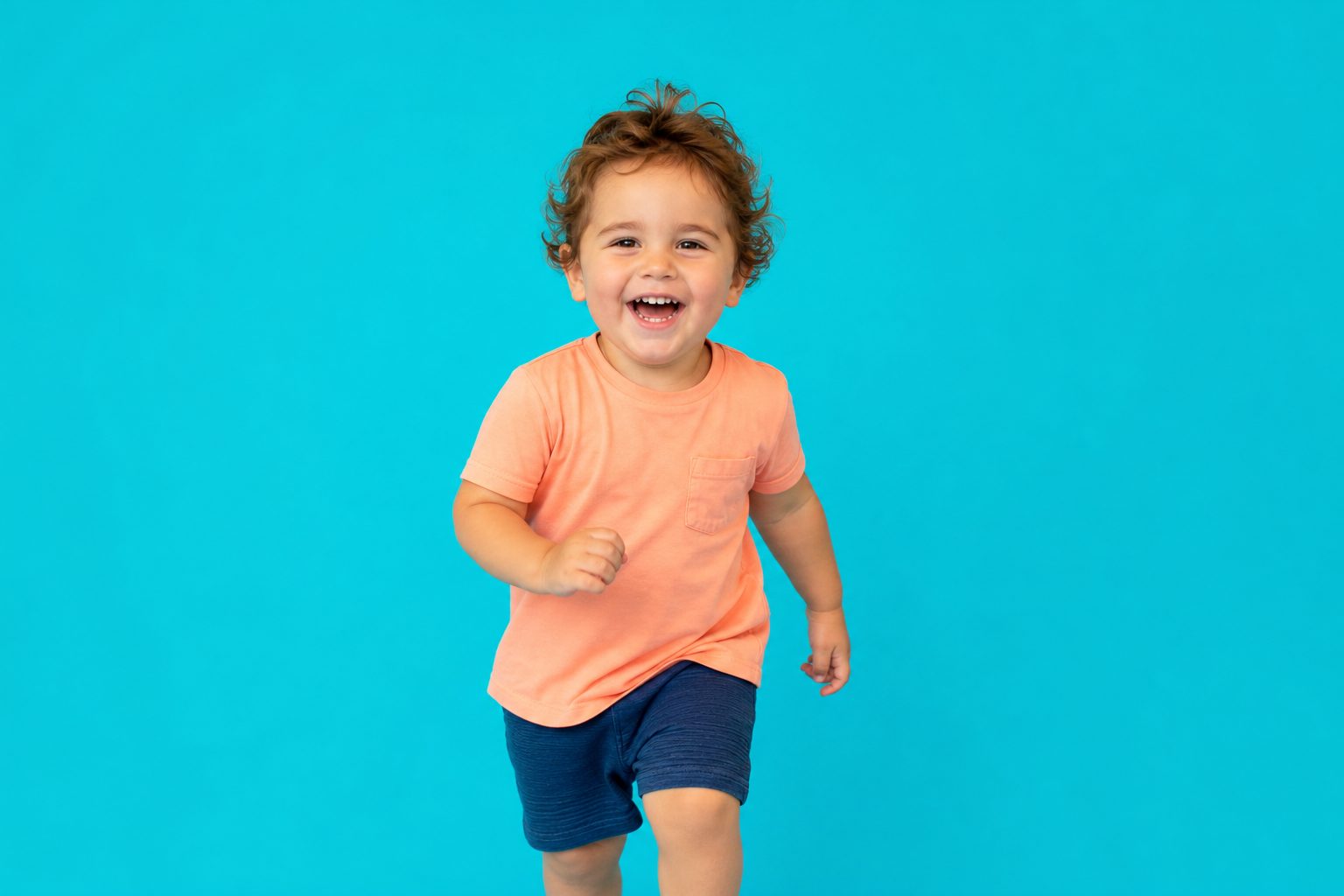 Bright childcare room with a vivid coloured backdrop set up in one corner